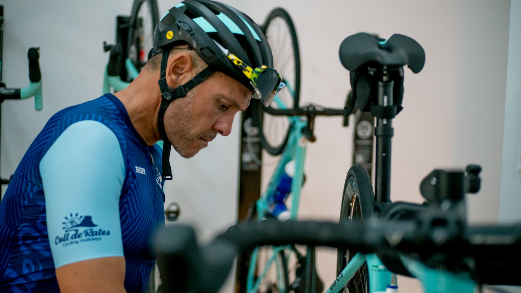 Coll de Rates Cycling mechanic inspecting a road bike in the workshop